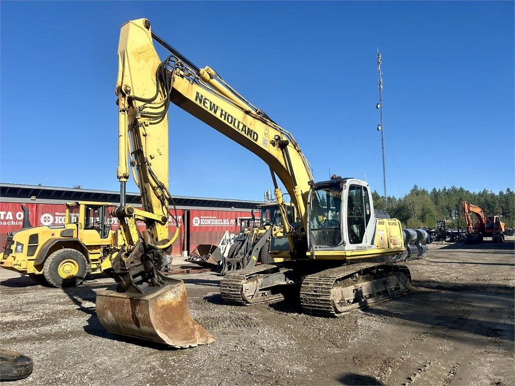 Pelle sur chenille New Holland E215B KAUHALLA: photos 7